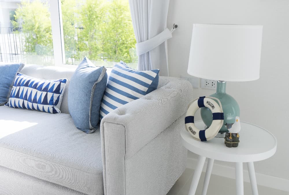 coastal themed living room with blue cushions and seaside accessories